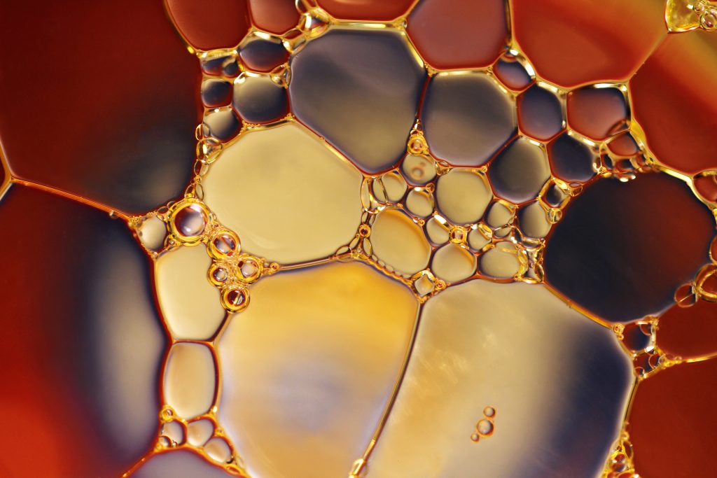 macro shot of car oil with air bubbles in it.